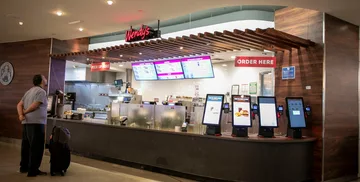 Customer standing in front of Wendy's at SFO